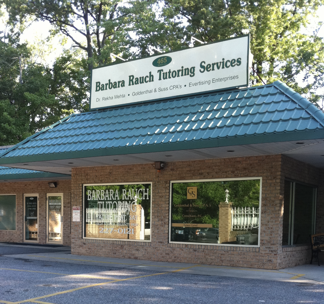 A building with a sign on the front of it